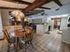 Bright dining area connected to the kitchen, featuring a unique chandelier and ample natural light at 11307 Sandpine Rd, Riverview, FL 33569
