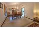 Elegant dining room featuring a classic chandelier and ample natural light at 11307 Sandpine Rd, Riverview, FL 33569
