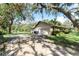 Long driveway leading to a two car garage at 11307 Sandpine Rd, Riverview, FL 33569