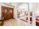 Welcoming foyer featuring tile floors, columns, and a wooden door with decorative stained glass insert at 11307 Sandpine Rd, Riverview, FL 33569