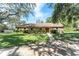 Charming single-story home with well-maintained lawn and stone accents at 11307 Sandpine Rd, Riverview, FL 33569