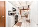 Bright kitchen with white cabinetry, modern appliances, and an adjacent dining area at 11307 Sandpine Rd, Riverview, FL 33569