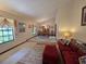 Spacious living room with large windows, plush seating, and open dining area at 11307 Sandpine Rd, Riverview, FL 33569