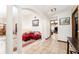 Bright living room with tile flooring, columns, and comfortable seating for relaxing and entertaining at 11307 Sandpine Rd, Riverview, FL 33569