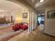 Open-concept living room with a red sofa, decorative pillows, and seamless access to the dining area at 11307 Sandpine Rd, Riverview, FL 33569