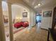 Spacious living room with tile floors, classic columns, and dining area access at 11307 Sandpine Rd, Riverview, FL 33569