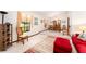 Open concept living room and dining area featuring vaulted ceiling and carpeted floors at 11307 Sandpine Rd, Riverview, FL 33569