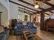 Open-concept living area with exposed beams, a wet bar, and a dining area at 11307 Sandpine Rd, Riverview, FL 33569