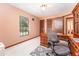 Bright home office featuring a desk, windows, and plush carpet at 11307 Sandpine Rd, Riverview, FL 33569