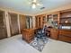 A well-appointed home office boasts a built-in desk and comfortable workspace at 11307 Sandpine Rd, Riverview, FL 33569