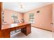 Spacious office featuring plush carpet, a ceiling fan, and natural light from the windows at 11307 Sandpine Rd, Riverview, FL 33569
