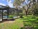 Screened-in pool and patio offers outdoor living and views of backyard at 11307 Sandpine Rd, Riverview, FL 33569