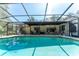 Beautiful screened-in pool with spacious patio area for entertaining, and a clear blue inviting cool water at 11307 Sandpine Rd, Riverview, FL 33569