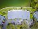 Aerial view of condo community with parking and manicured landscaping, near bay access for waterfront living at 12132 Capri S Cir, Treasure Island, FL 33706
