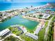 Stunning aerial view of waterfront homes with boat docks and ocean access at 12132 Capri S Cir, Treasure Island, FL 33706