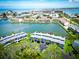 Aerial view of well-maintained waterfront condos with lovely landscaping, creating a serene and appealing atmosphere at 12132 Capri S Cir, Treasure Island, FL 33706