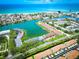 Aerial view showcases a waterfront community with beach access and picturesque surroundings at 12132 Capri S Cir, Treasure Island, FL 33706