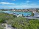 Stunning aerial view showcasing waterfront homes, lush greenery, and a serene coastal setting at 12132 Capri S Cir, Treasure Island, FL 33706