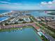 View of community, pool, and surrounding neighborhood, with waterfront access at 12132 Capri S Cir, Treasure Island, FL 33706