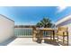 Relaxing balcony features an outdoor table and chairs with waterfront views at 12132 Capri S Cir, Treasure Island, FL 33706