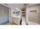 Updated bathroom featuring a modern vanity, a shower-tub combination, and neutral décor at 12132 Capri S Cir, Treasure Island, FL 33706
