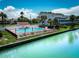 Enjoy this community pool with views, loungers, umbrellas, a fenced area and proximity to the canal at 12132 Capri S Cir, Treasure Island, FL 33706