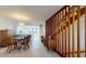 Charming dining area with staircase, and open view to the kitchen at 12132 Capri S Cir, Treasure Island, FL 33706