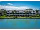 Waterfront condo complex features multiple units with private balconies and lush landscaping at 12132 Capri S Cir, Treasure Island, FL 33706