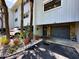 Close up of a condo unit showing landscaping and garage access at 12132 Capri S Cir, Treasure Island, FL 33706