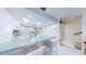 Charming kitchen with breakfast bar, white cabinets, and skylight providing natural light at 12132 Capri S Cir, Treasure Island, FL 33706