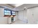 Cozy kitchenette area featuring a window and ample storage space at 12132 Capri S Cir, Treasure Island, FL 33706