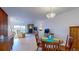 Inviting living room with stone fireplace, chandelier and view of the waterway at 12132 Capri S Cir, Treasure Island, FL 33706