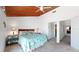 View of main bedroom with wooden ceiling and coastal decor and furnishings at 12132 Capri S Cir, Treasure Island, FL 33706