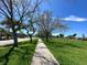 Paved path with green grass on a sunny day, inviting for a walk or bike ride near the community at 12132 Capri S Cir, Treasure Island, FL 33706