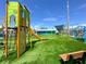 Colorful playground with climbing structures and slides, perfect for entertainment at 12132 Capri S Cir, Treasure Island, FL 33706
