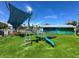 Playground area featuring modern play equipment and safety surfaces, enhancing outdoor fun for  at 12132 Capri S Cir, Treasure Island, FL 33706