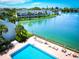Community pool offering a relaxing atmosphere with chaise lounges to enjoy the scenic waterway views at 12132 Capri S Cir, Treasure Island, FL 33706