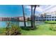 Scenic waterfront view featuring lush landscaping, serene waters, and well-maintained residential buildings at 12132 Capri S Cir, Treasure Island, FL 33706