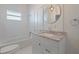 A stylish bathroom features a modern vanity with granite countertop and subway tile at 1225 22Nd S Ave, St Petersburg, FL 33705