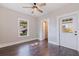 Hardwood bedroom with a ceiling fan, window, closet and door leading to porch at 1225 22Nd S Ave, St Petersburg, FL 33705