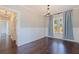 A spacious dining room boasting hardwood floors, white trim, and a modern light fixture at 1225 22Nd S Ave, St Petersburg, FL 33705