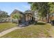 Inviting single-Gathering home featuring a landscaped yard, quaint porch, and a cozy, welcoming facade at 1225 22Nd S Ave, St Petersburg, FL 33705