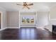 Airy living room featuring a brick fireplace, hardwood floors, and an abundance of natural light at 1225 22Nd S Ave, St Petersburg, FL 33705