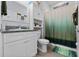 Bathroom featuring granite countertops, white cabinets, and shower-tub combination at 13301 Waterleaf Garden Cir, Riverview, FL 33579