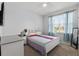 Bedroom with a large window, neutral paint, and carpet flooring at 13301 Waterleaf Garden Cir, Riverview, FL 33579