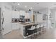 Modern kitchen with white cabinets, a stylish island, and stainless steel appliances at 13301 Waterleaf Garden Cir, Riverview, FL 33579