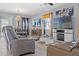 Comfortable living room featuring stylish furniture, modern lighting, and decorative accents at 13301 Waterleaf Garden Cir, Riverview, FL 33579