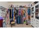 Spacious walk-in closet with custom shelving for clothes, shoes, and accessories at 13301 Waterleaf Garden Cir, Riverview, FL 33579