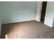Clean bedroom with light walls, soft carpeting, a spacious closet, and ample natural light at 15733 Stable Run Dr, Spring Hill, FL 34610