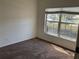 Cozy bedroom featuring neutral carpeting, a bright window, and ample space for relaxation and personalization at 15733 Stable Run Dr, Spring Hill, FL 34610